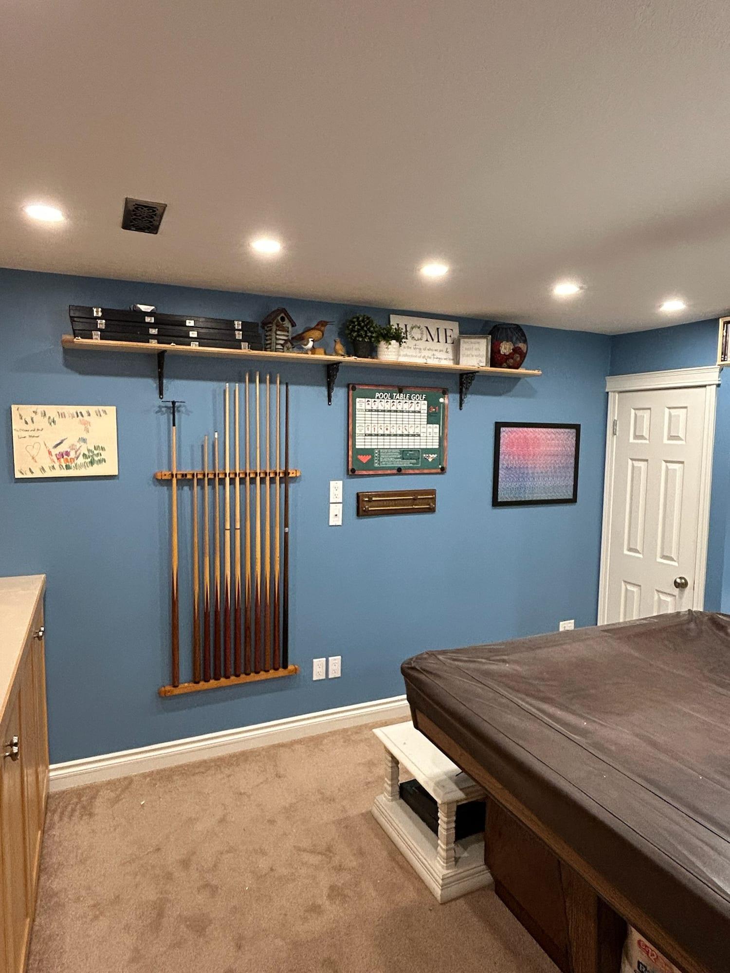 Games room with blue painted walls and white trim